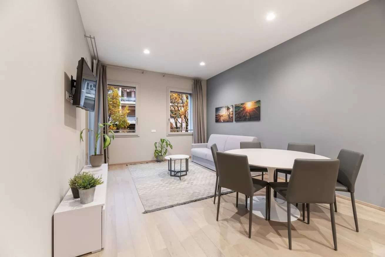 Contemporary two-bedroom suite featuring a spacious lounge and sleek kitchenette.