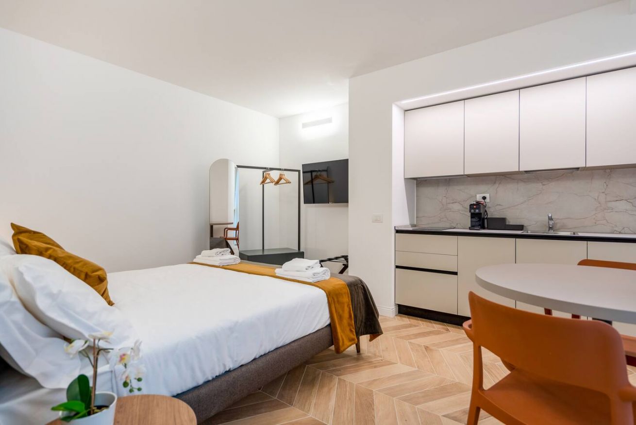 Bright modern studio with kitchen and cozy sleeping area in Trieste.
