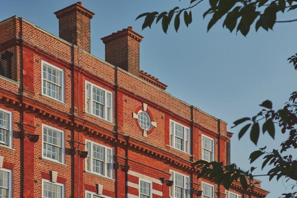 Picturesque Westminster street lined with elegant Georgian terraces mature trees and classic London architecture in prestigious central location