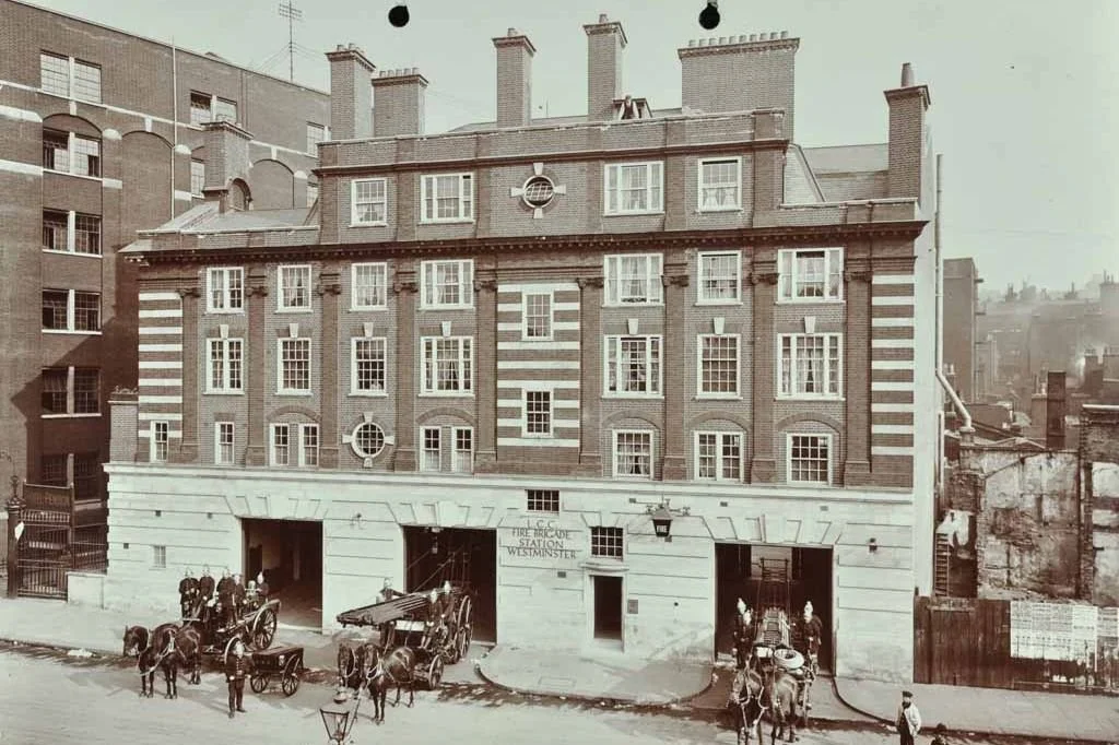 Historic fire station interior revealing original Victorian architectural elements with ornate ceramic tilework and period details preserving century-old heritage