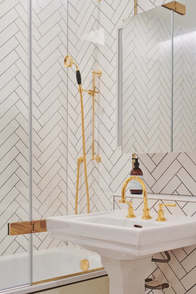 Serene luxury bedroom retreat with sumptuous bedding exposed brick feature wall and soft ambient lighting creating perfect sanctuary for rest and relaxation