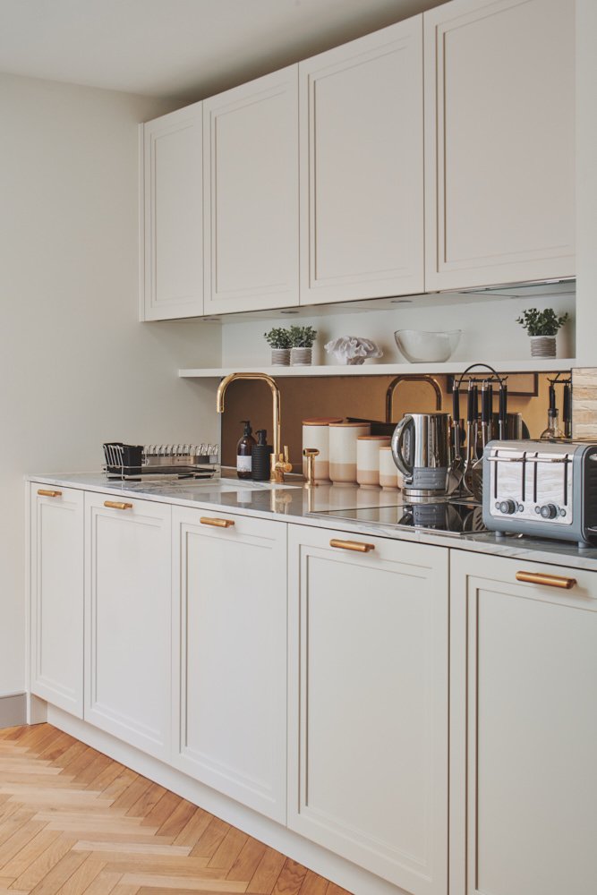 Grand original Victorian carriage doors entrance with ornate metalwork and historic charm welcoming guests into luxury Westminster Fire Station apartments