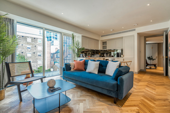 One-Bed + Sofa-Bed apartment living area